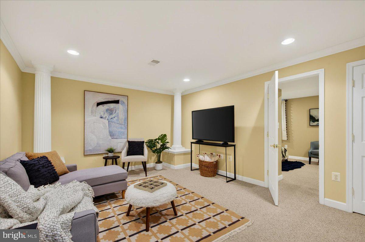 7723 Silver Sage Court Springfield, VA 22153 - Photo 46 of 63 a living room with furniture and a flat screen tv