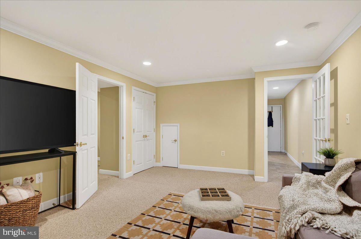 7723 Silver Sage Court Springfield, VA 22153 - Photo 48 of 63 a bedroom with furniture and a flat screen tv