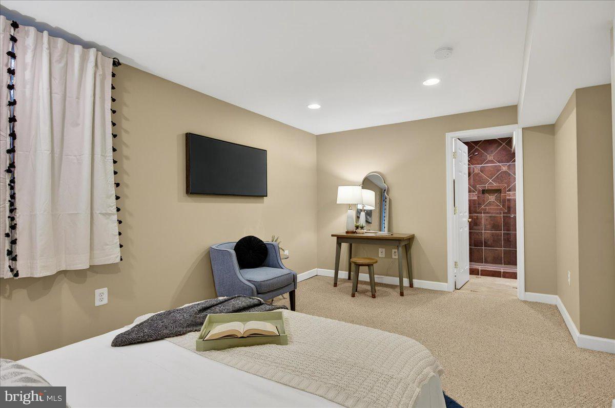 7723 Silver Sage Court Springfield, VA 22153 - Photo 50 of 63 a work room with furniture a flat screen tv and a window