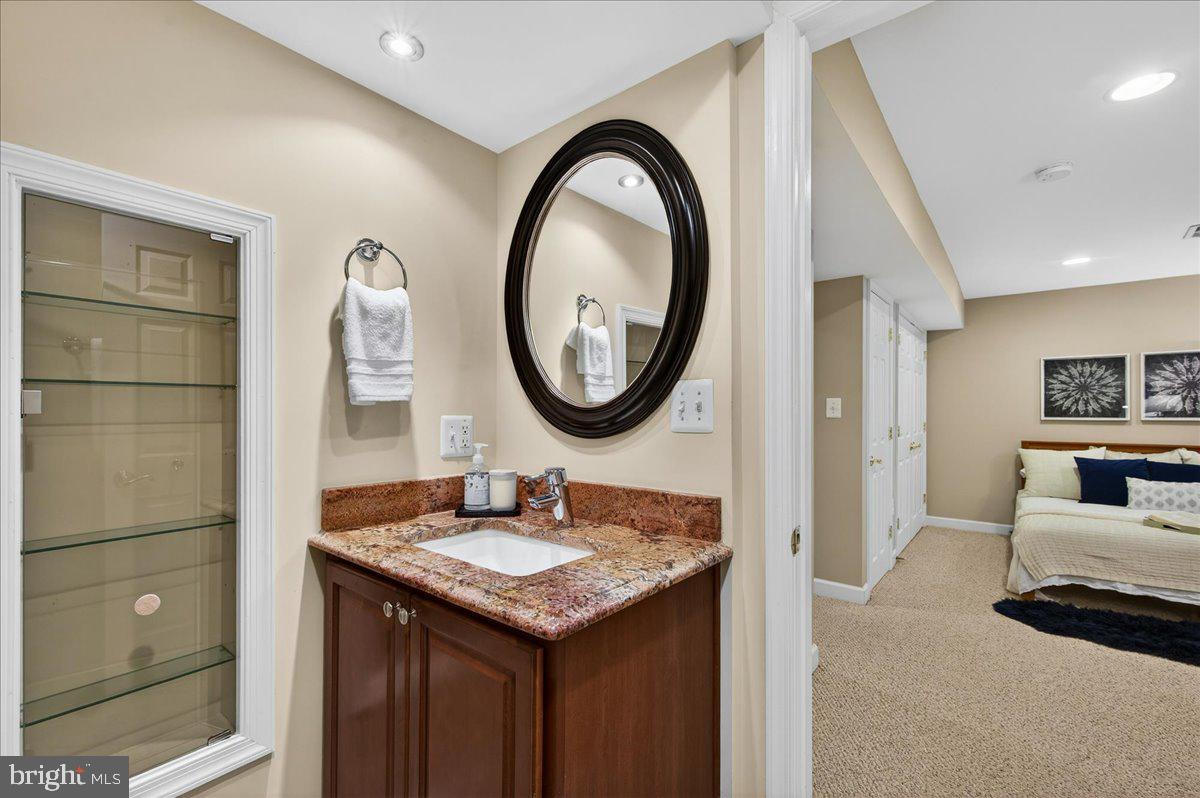 7723 Silver Sage Court Springfield, VA 22153 - Photo 51 of 63 a bathroom with a sink and a mirror