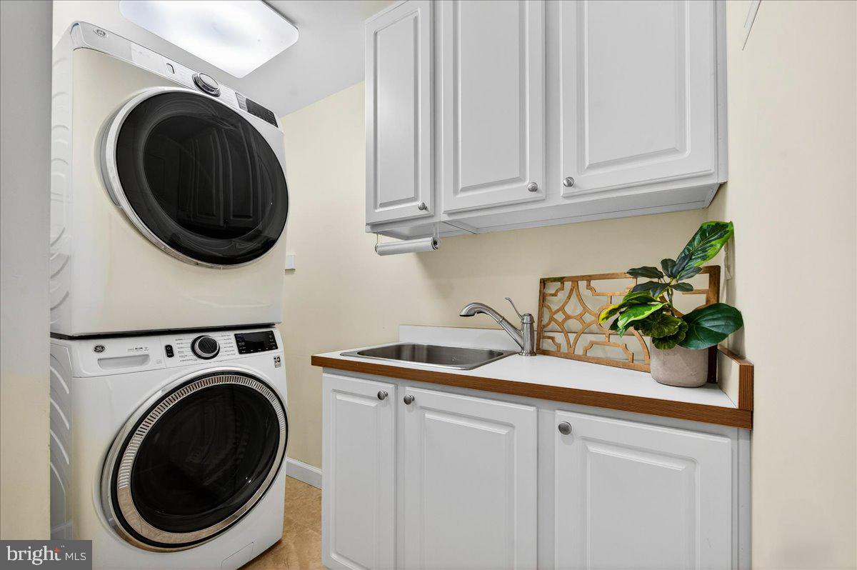 7723 Silver Sage Court Springfield, VA 22153 - Photo 53 of 63 a view of a storage and utility room with washer and dryer
