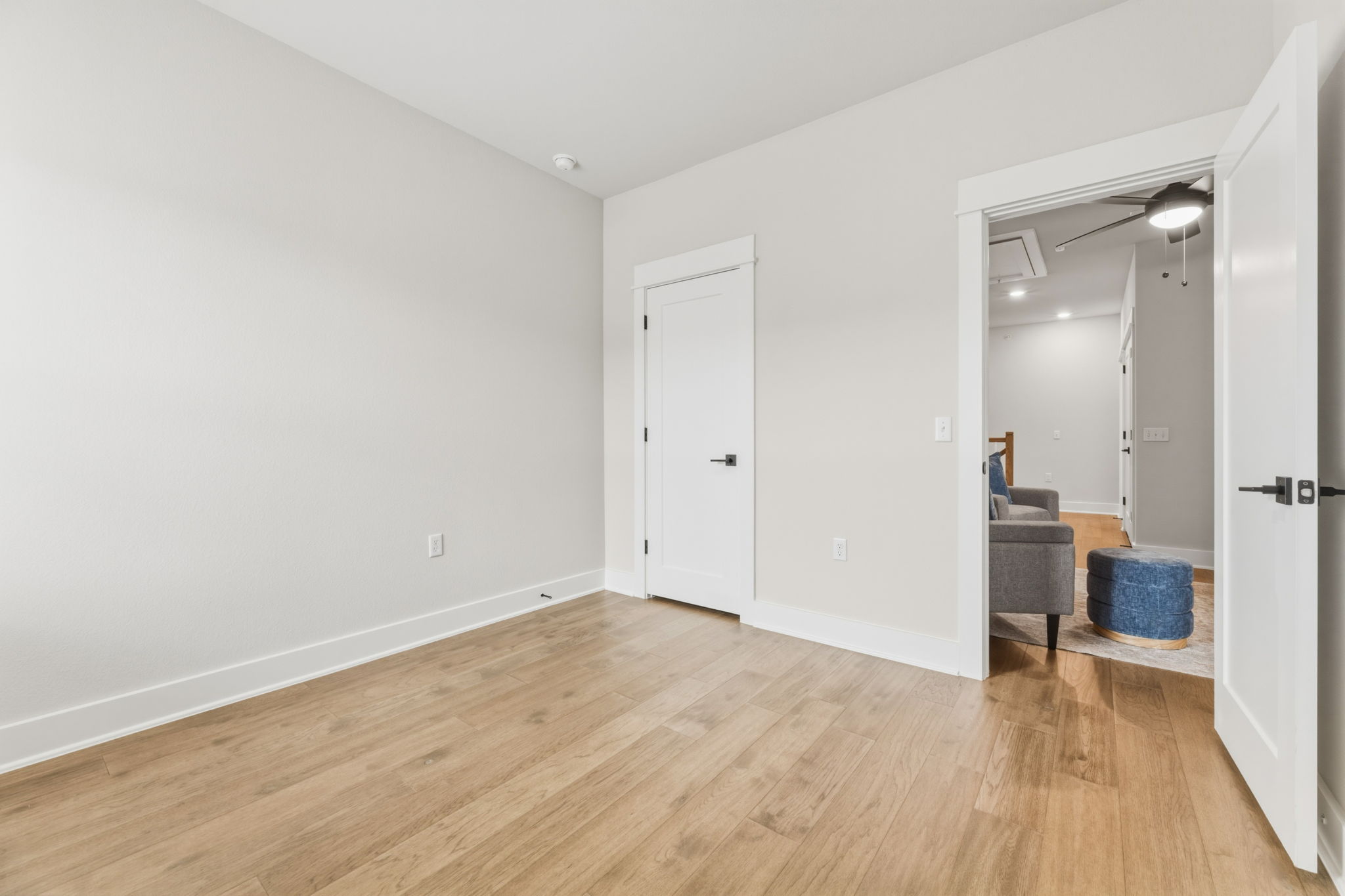 2929 Moreno Street Austin, TX 78723 - Photo 38 of 40 Light wood-finish flooring with white baseboards and neutral wall tones