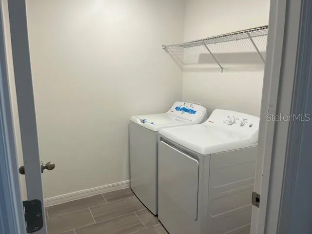 a utility room with dryer and washer