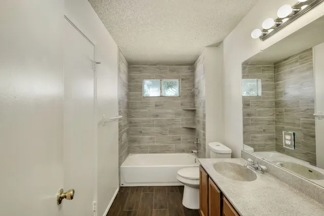 a bathroom with a sink toilet bathtub and shower