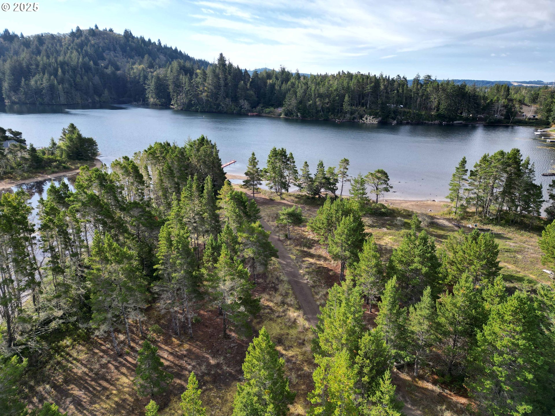 Nordahl Road Florence, OR 97439 - Photo 6 of 20 a view of a lake with a mountain in the background