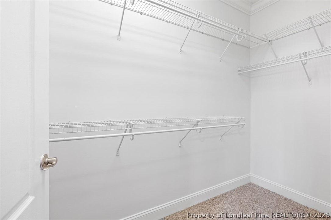 62 Gallery Drive, Unit 102 Spring Lake, NC 28390 - Photo 14 of 23 a view of a room with racks on the wall