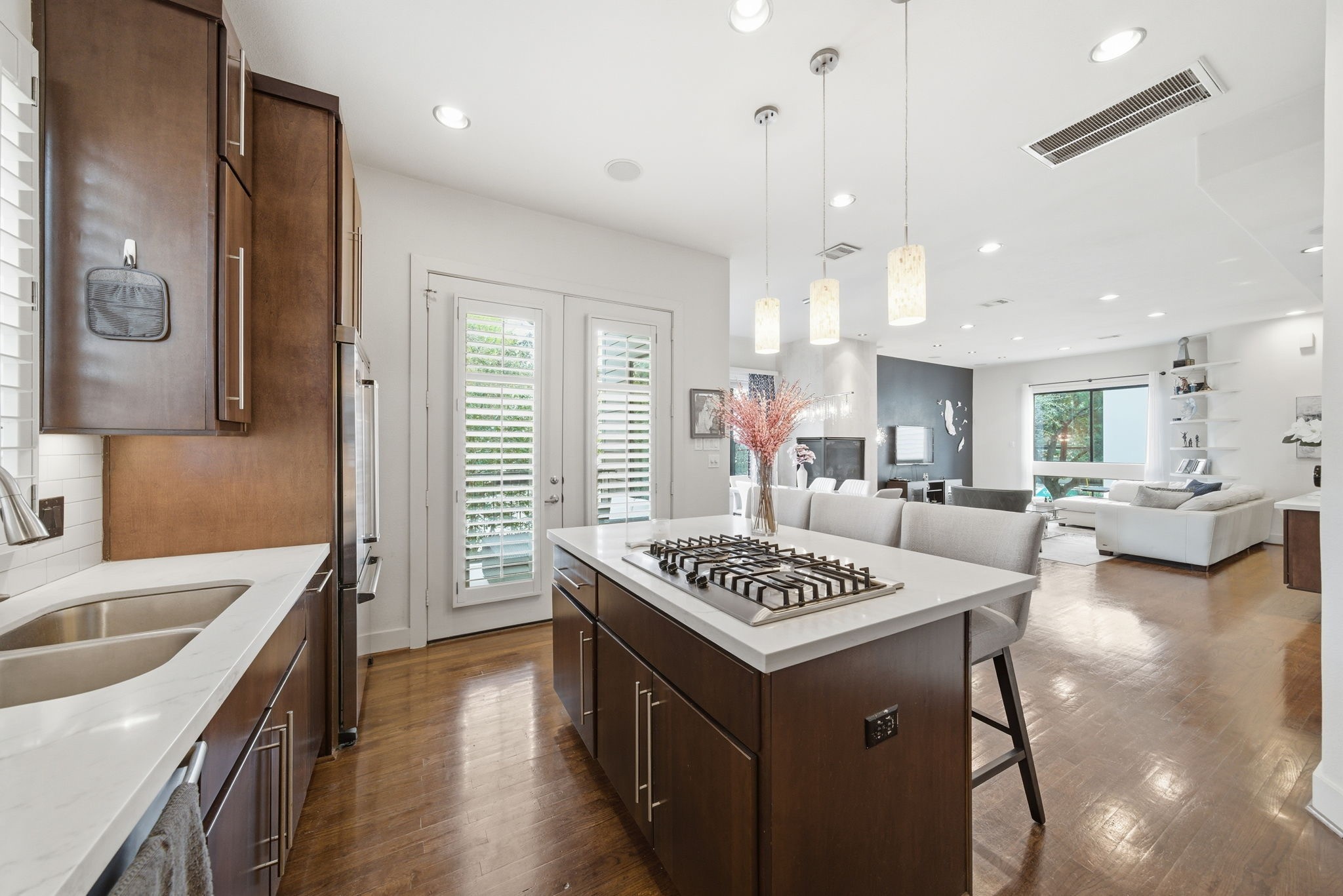4129 Dickson Street Houston, TX 77007 - Photo 11 of 36 a kitchen that has a lot of cabinets stove and wooden floor