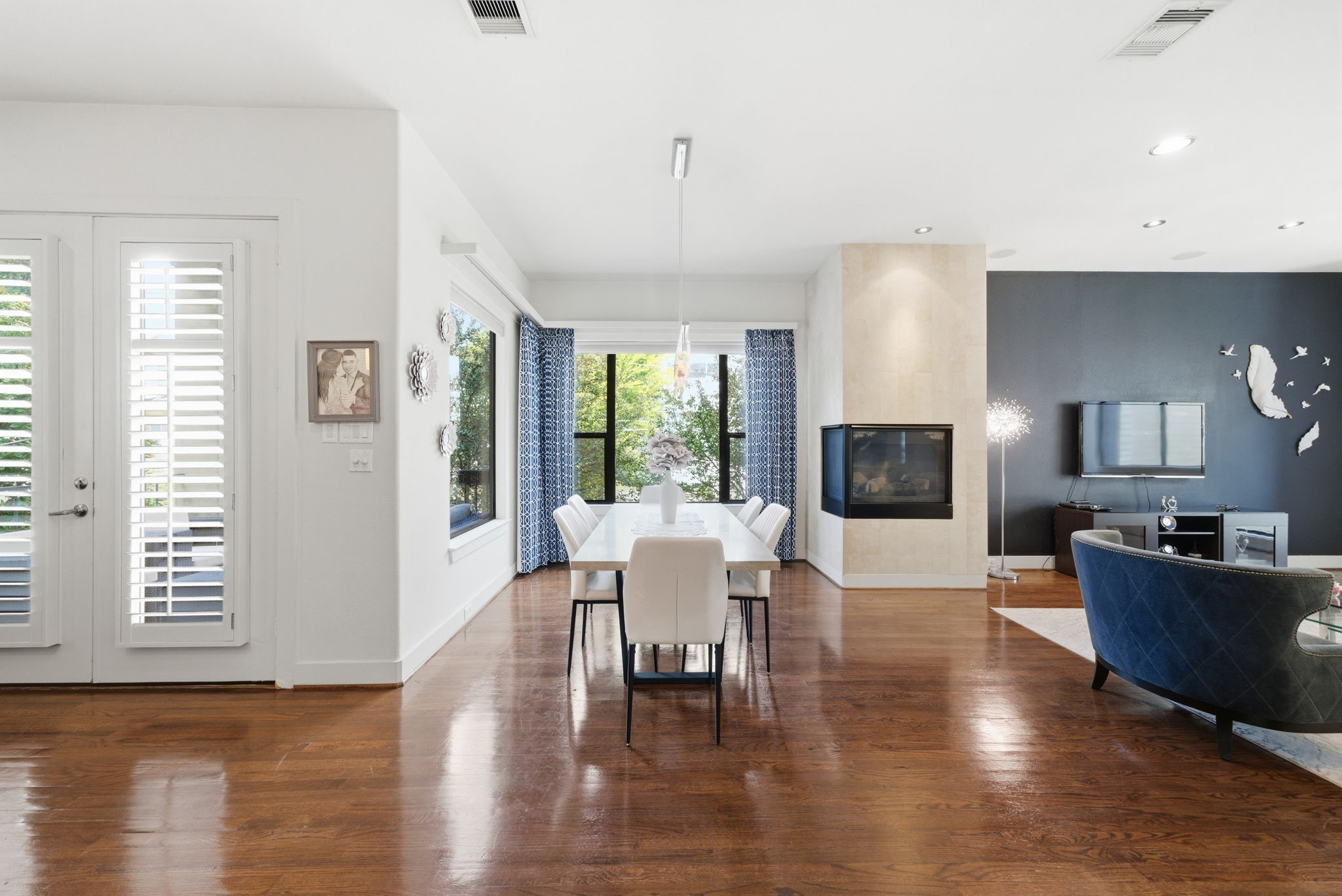 4129 Dickson Street Houston, TX 77007 - Photo 12 of 36 a living room with furniture a flat screen tv and wooden floor