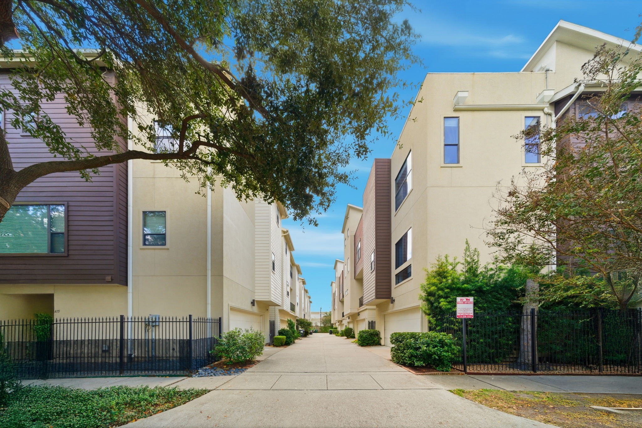 4129 Dickson Street Houston, TX 77007 - Photo 18 of 36 a front view of a house with a garden and trees