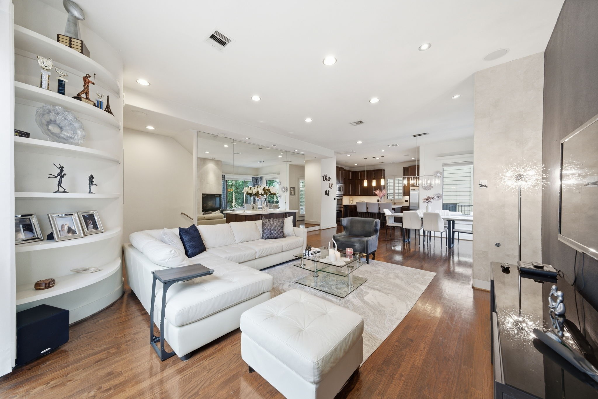 4129 Dickson Street Houston, TX 77007 - Photo 22 of 36 a living room with furniture and a wooden floor
