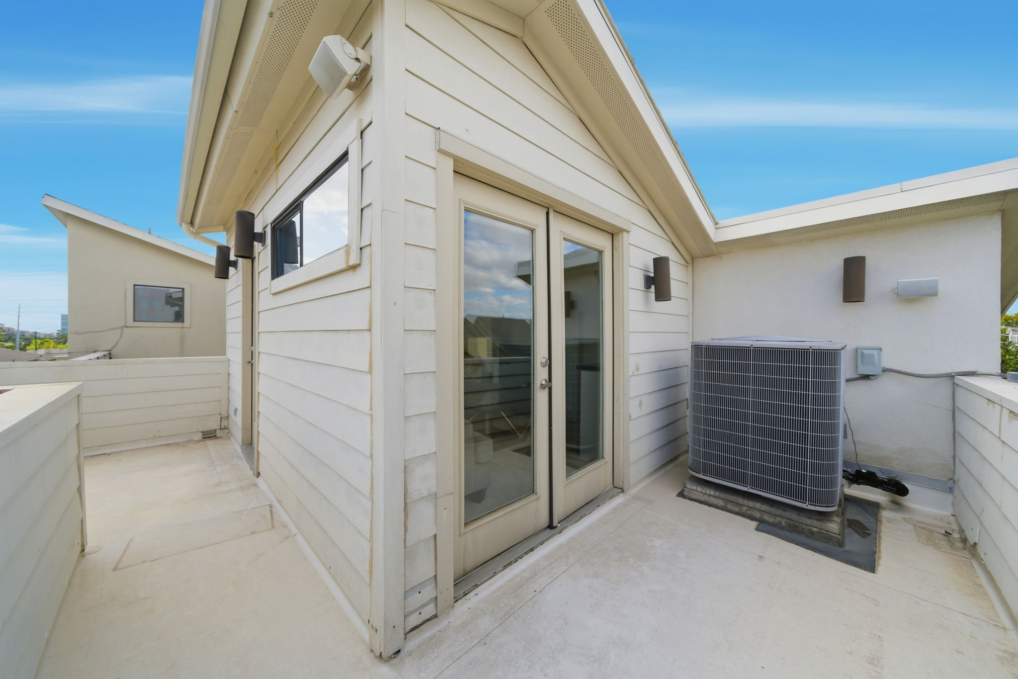 4129 Dickson Street Houston, TX 77007 - Photo 25 of 36 a view of a house with a barbeque and wooden door