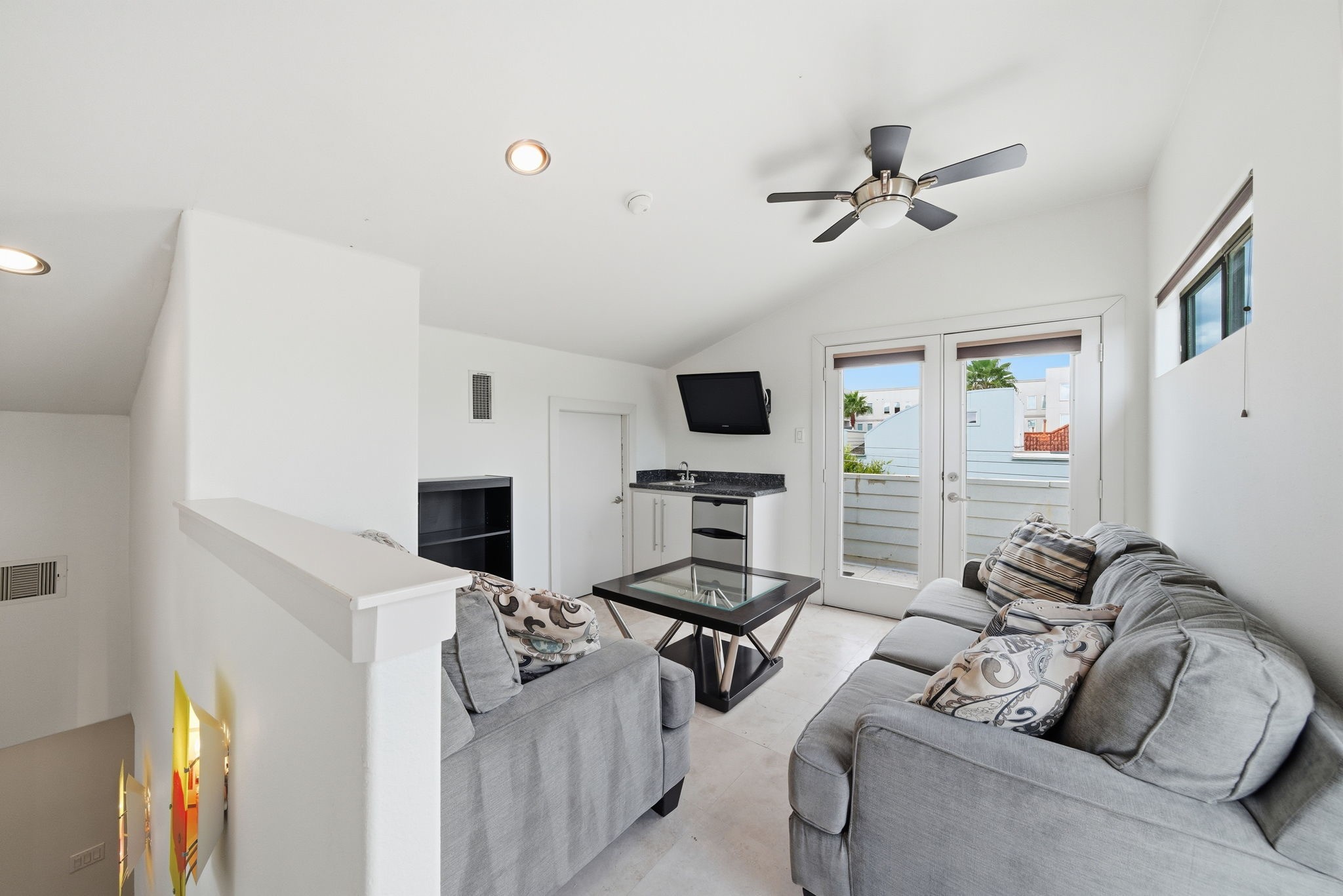 4129 Dickson Street Houston, TX 77007 - Photo 26 of 36 a living room with furniture a fireplace and a flat screen tv