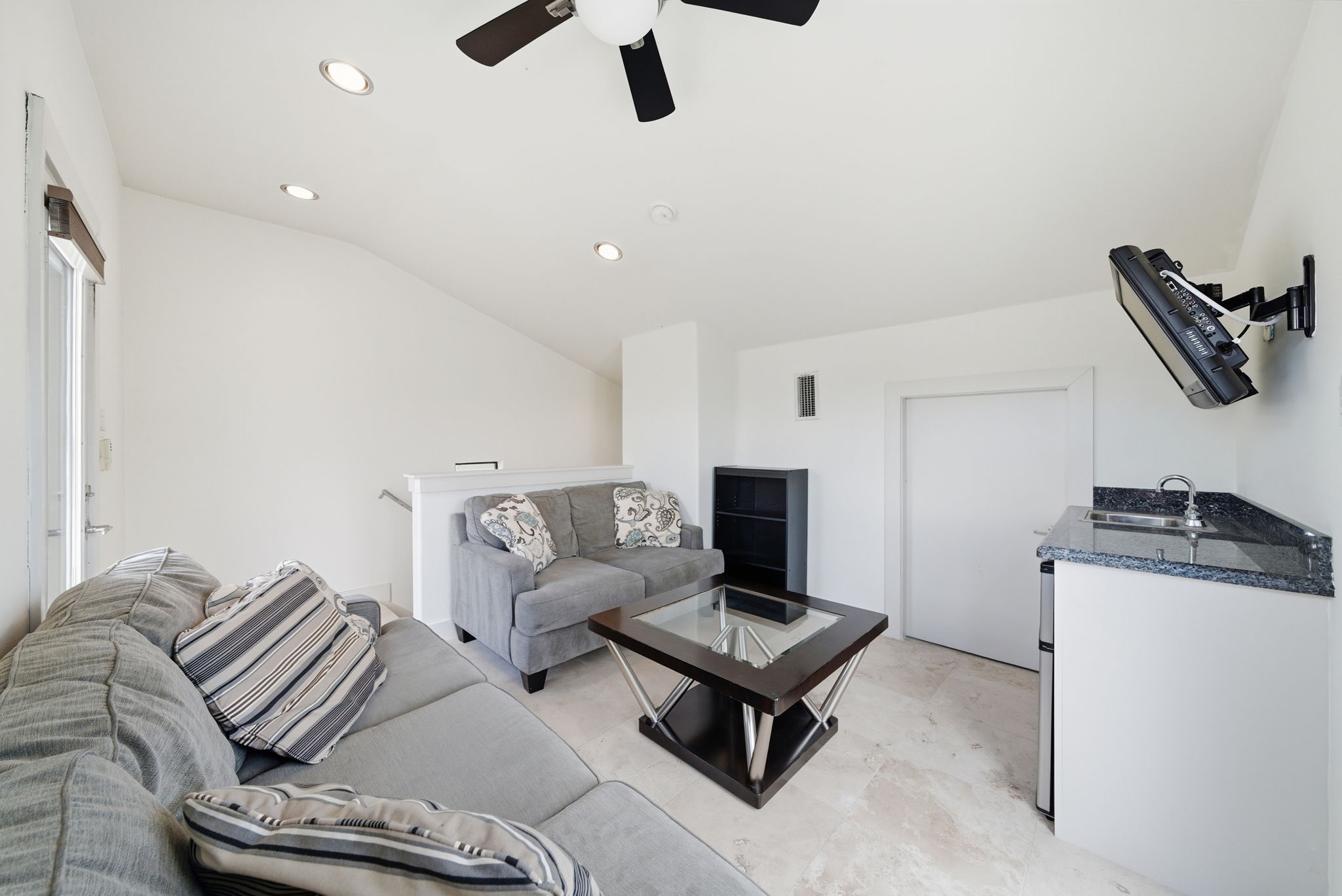 4129 Dickson Street Houston, TX 77007 - Photo 27 of 36 a living room with furniture and a ceiling fan