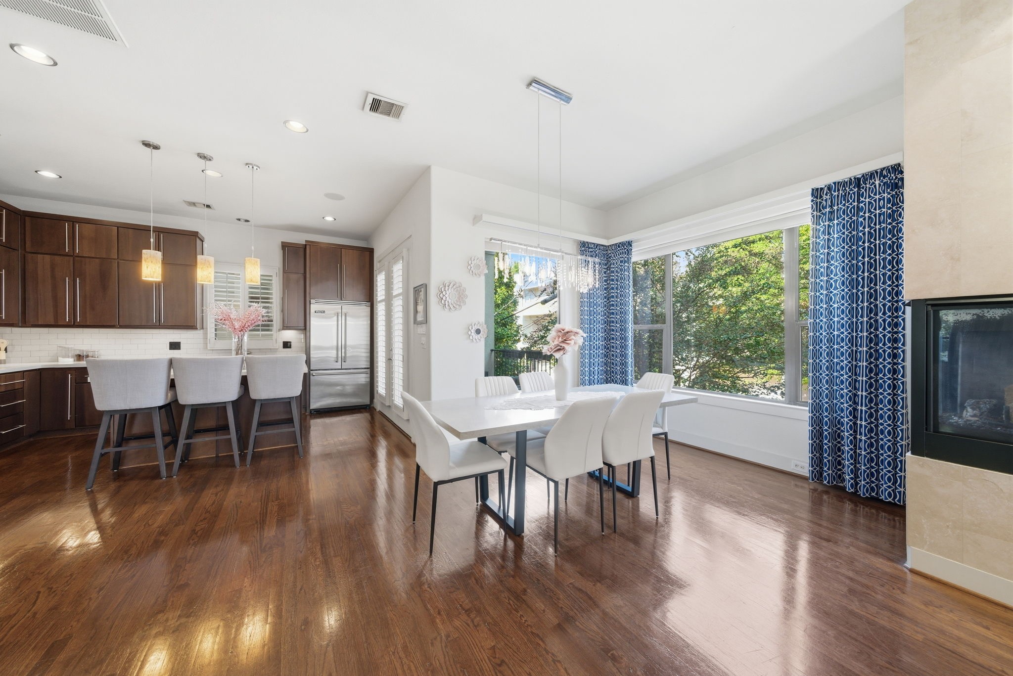 4129 Dickson Street Houston, TX 77007 - Photo 3 of 36 a view of a dining room with furniture and wooden floor