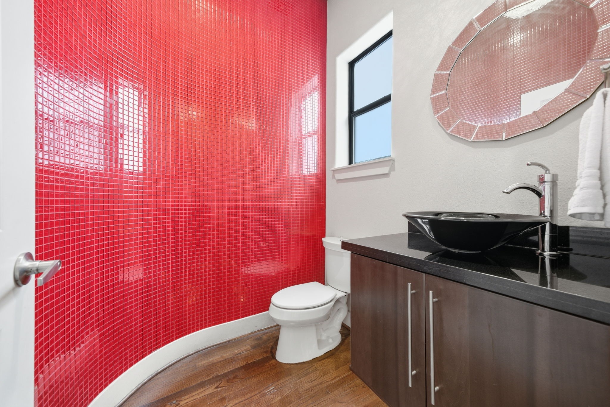 4129 Dickson Street Houston, TX 77007 - Photo 34 of 36 a bathroom with a sink a toilet and mirror