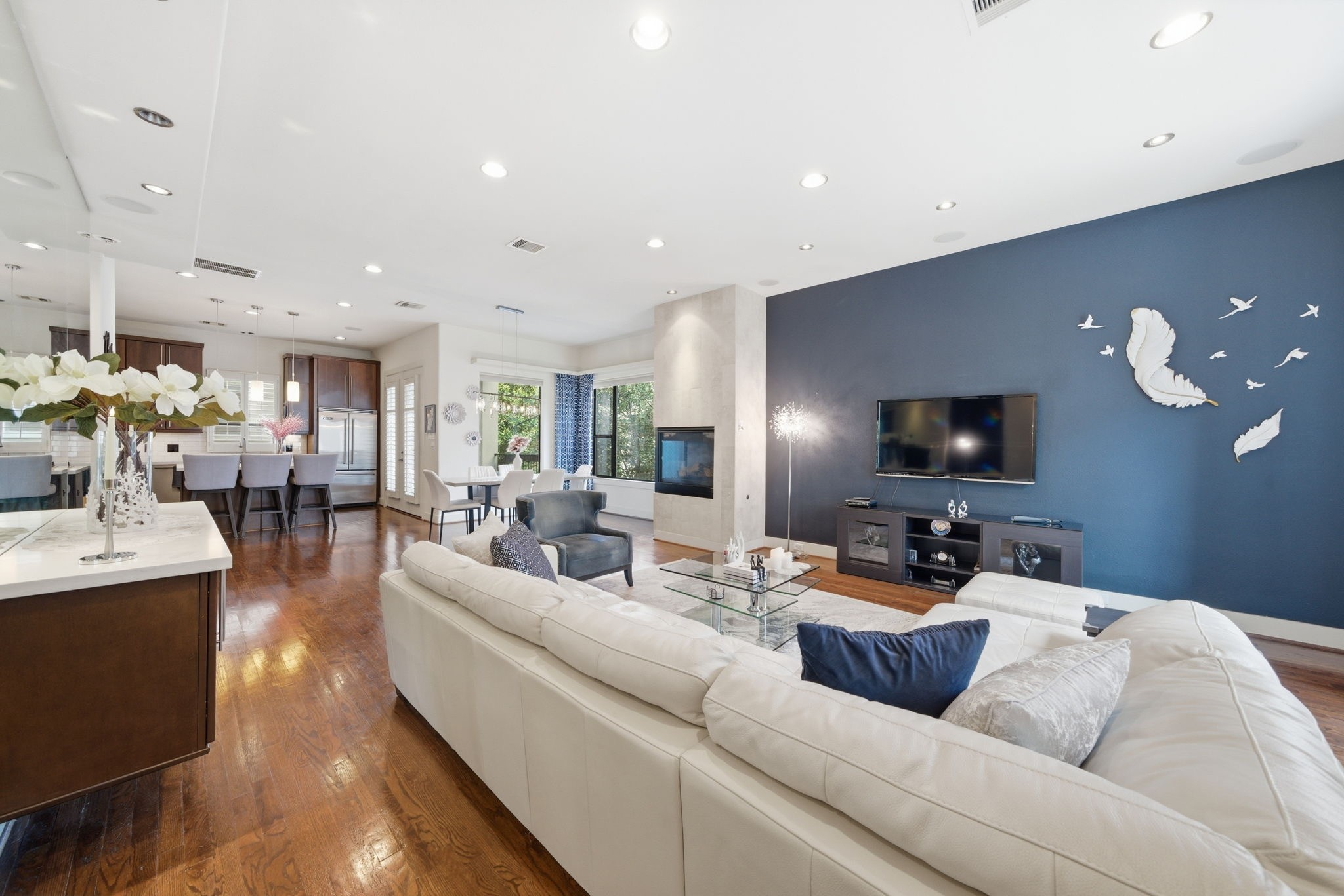 4129 Dickson Street Houston, TX 77007 - Photo 6 of 36 a living room with furniture and a flat screen tv
