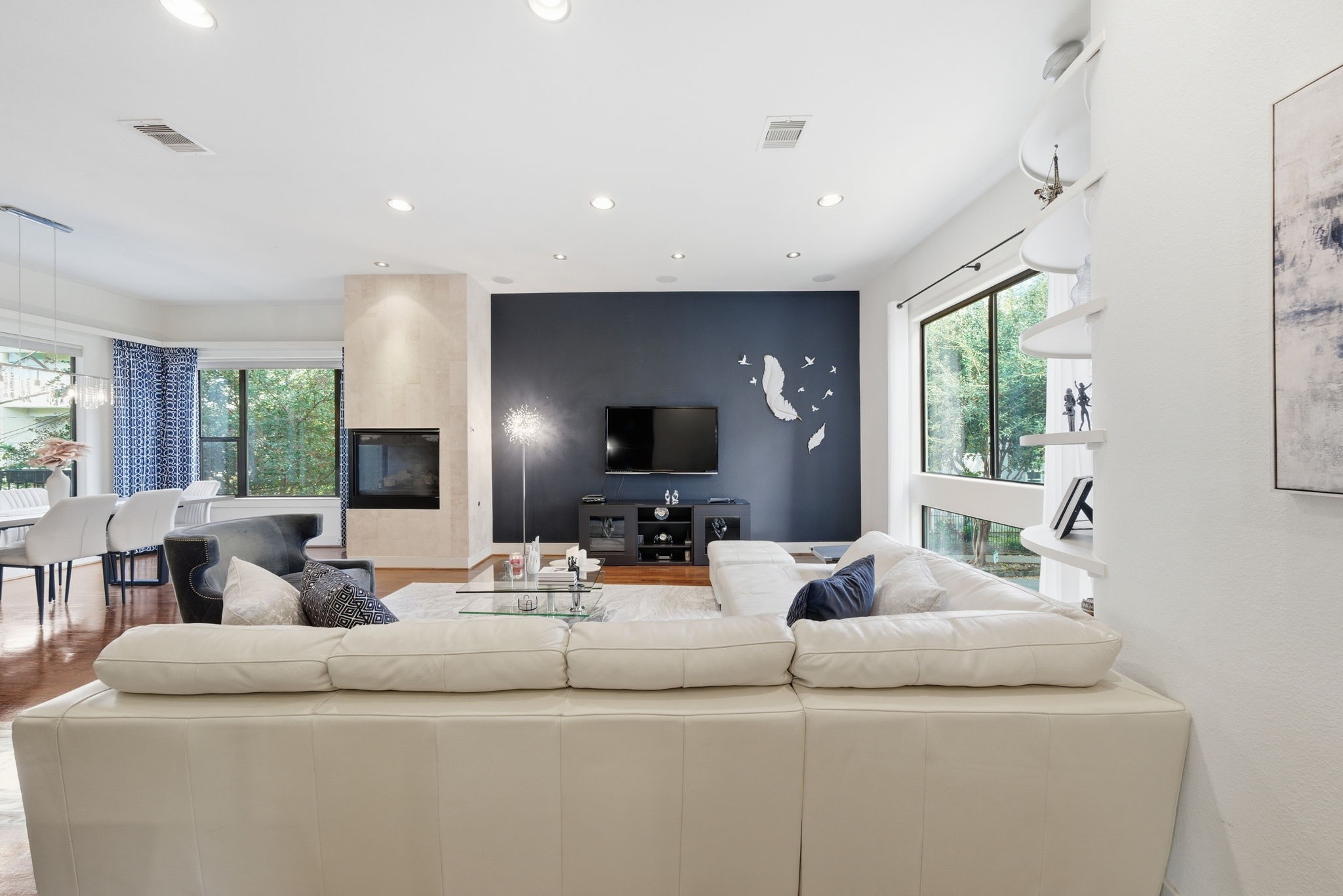 4129 Dickson Street Houston, TX 77007 - Photo 7 of 36 a living room with furniture and a flat screen tv