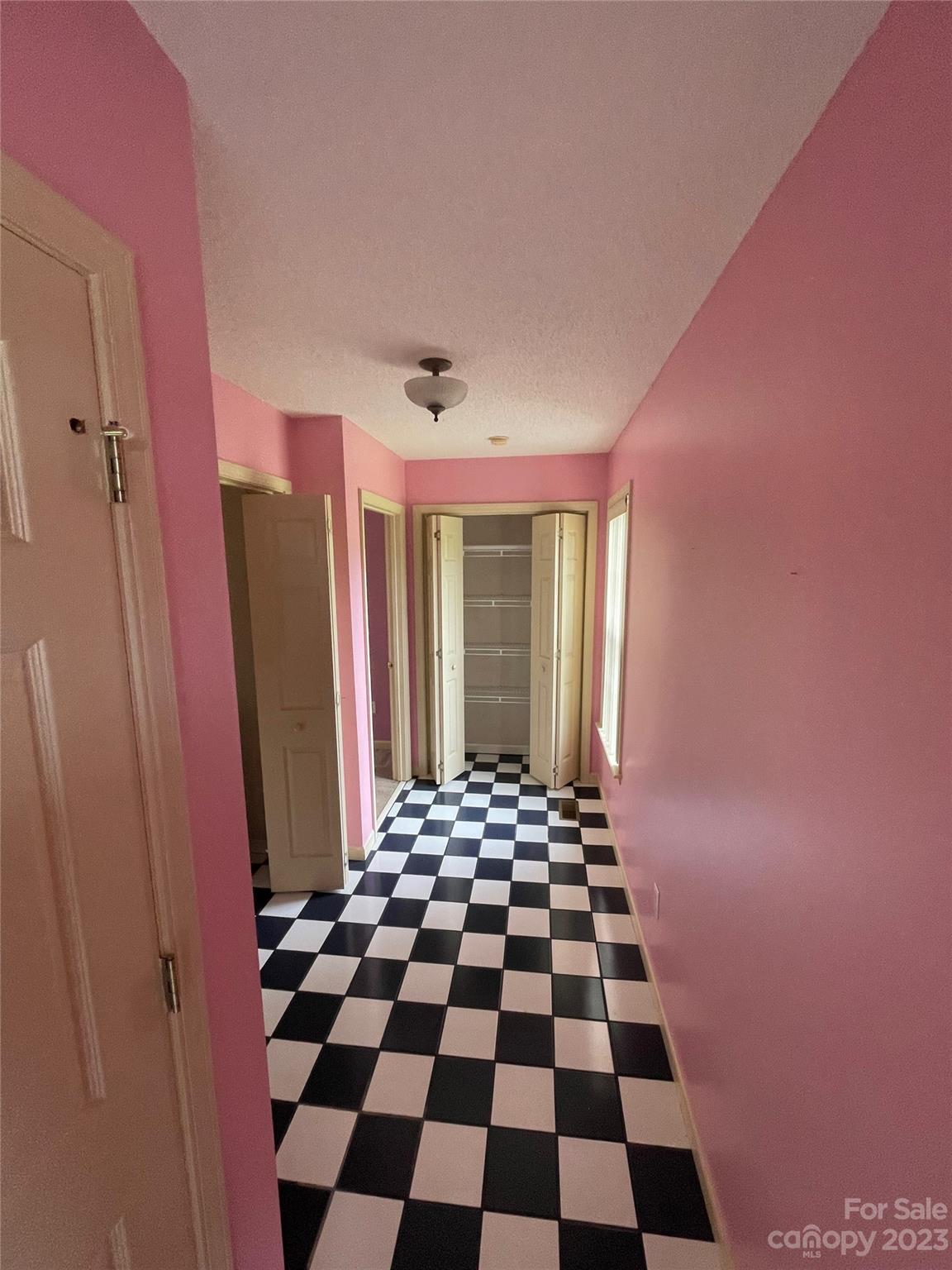 4 Grace Anna Lane Alexander, NC 28701 - Photo 27 of 38 a black and white checkered floor with a black white checkered floor next to a window