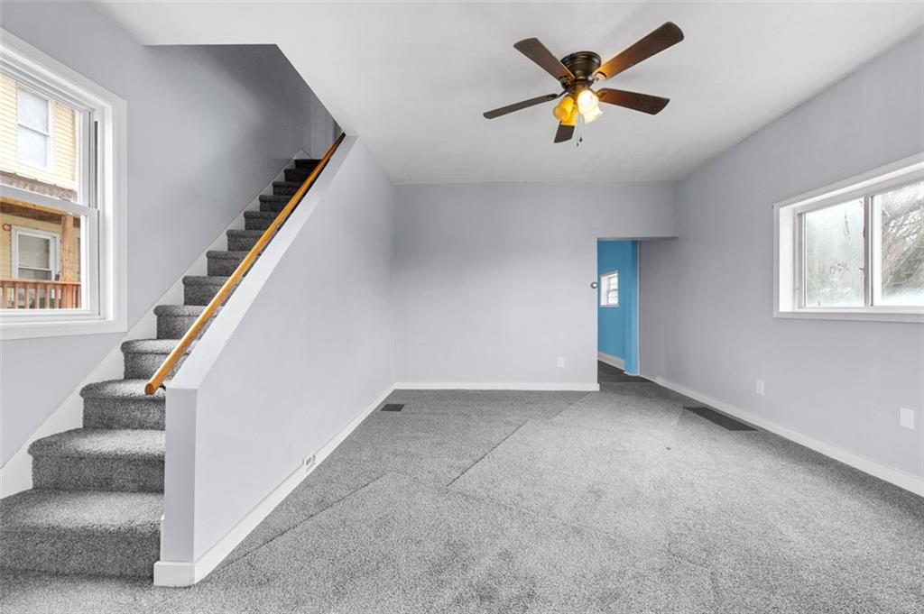 242 Union Street Dickerson Run, PA 15430 - Photo 11 of 17 wooden floor in an empty room with a window
