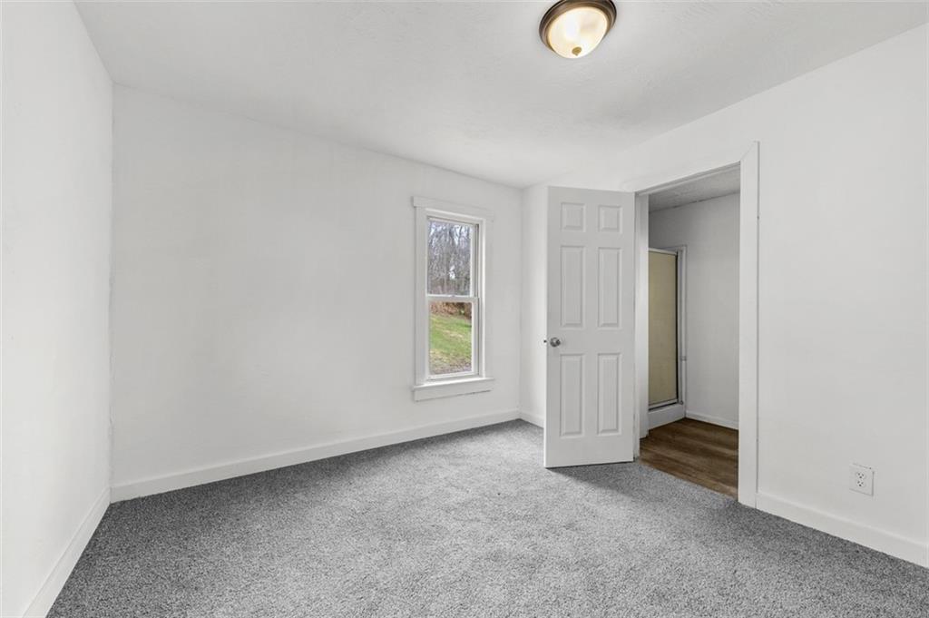 242 Union Street Dickerson Run, PA 15430 - Photo 12 of 17 an empty room with windows and closet