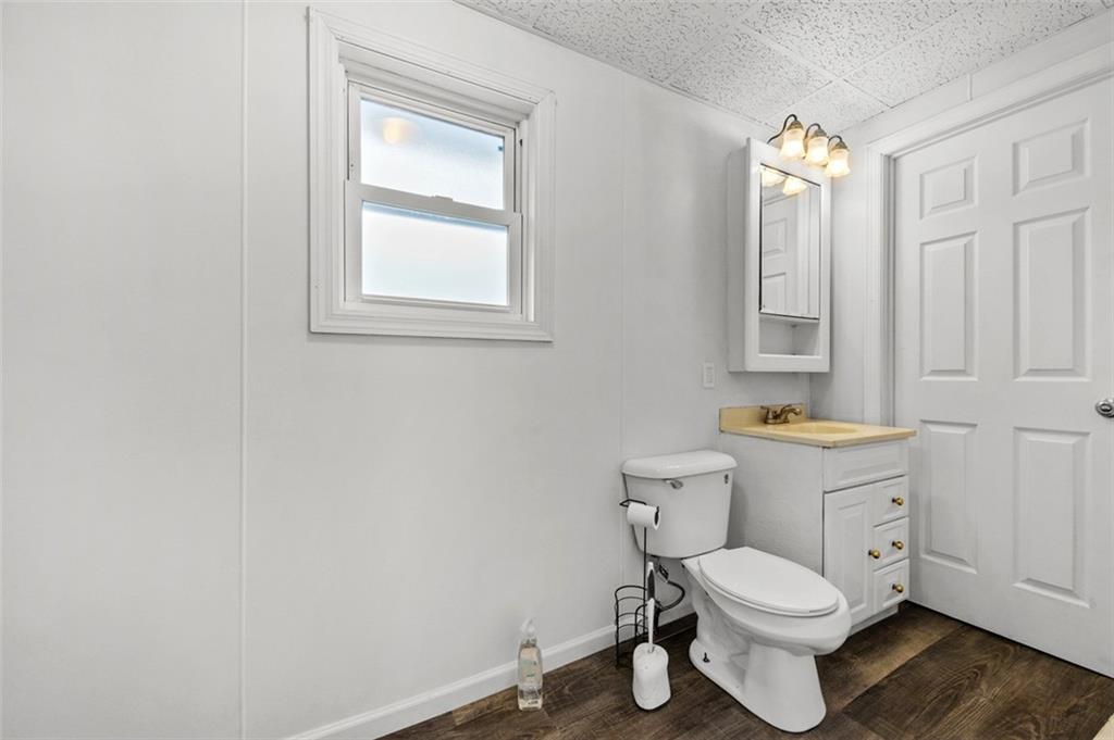 242 Union Street Dickerson Run, PA 15430 - Photo 13 of 17 a bathroom with a toilet a sink and a window