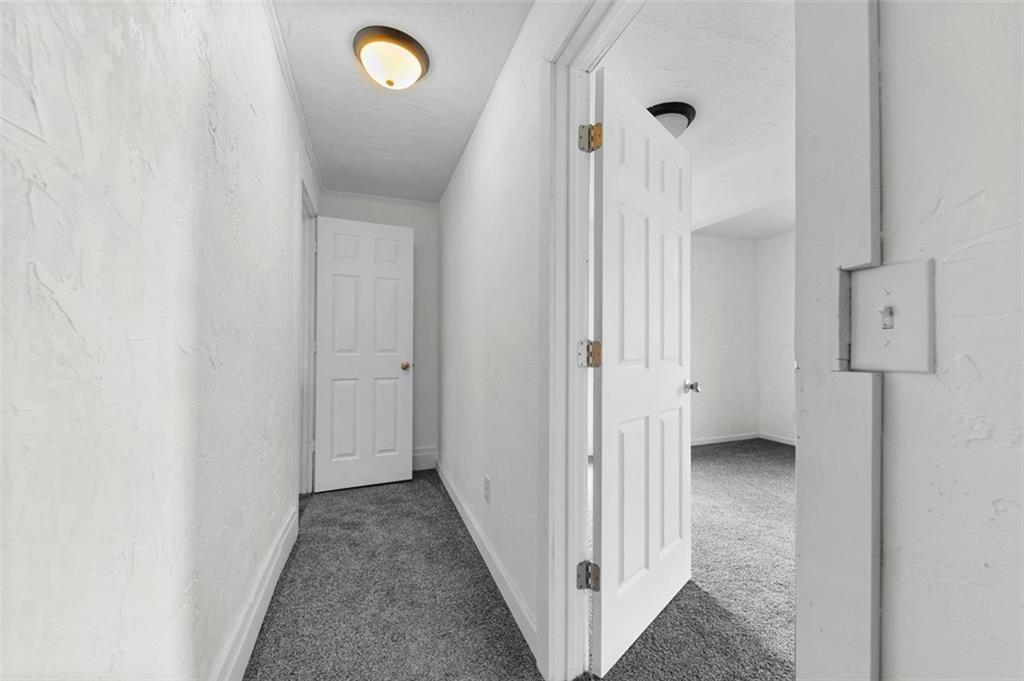 242 Union Street Dickerson Run, PA 15430 - Photo 15 of 17 a view of a hallway with wooden floor