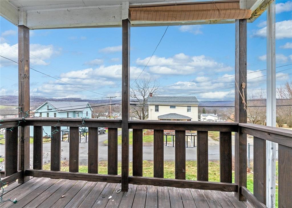 242 Union Street Dickerson Run, PA 15430 - Photo 3 of 17 a view of a balcony with wooden floor
