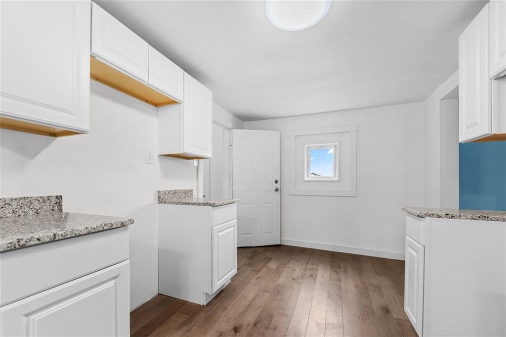 242 Union Street Dickerson Run, PA 15430 - Photo 6 of 17 a kitchen with a sink cabinets and wooden floor