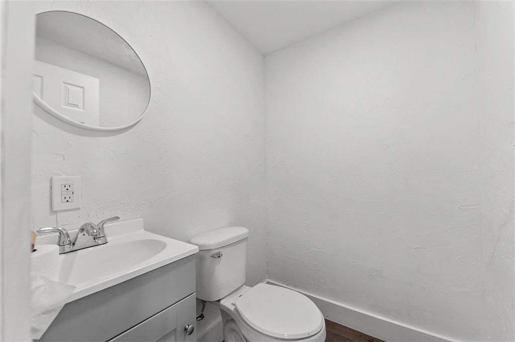 242 Union Street Dickerson Run, PA 15430 - Photo 7 of 17 a white toilet sitting next to a bathroom sink