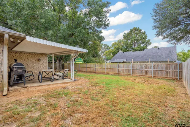 a view of a house with pool and sitting area