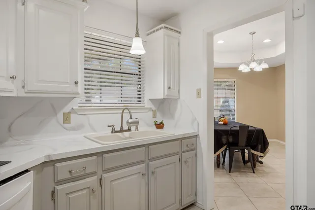 a kitchen with a sink and cabinets