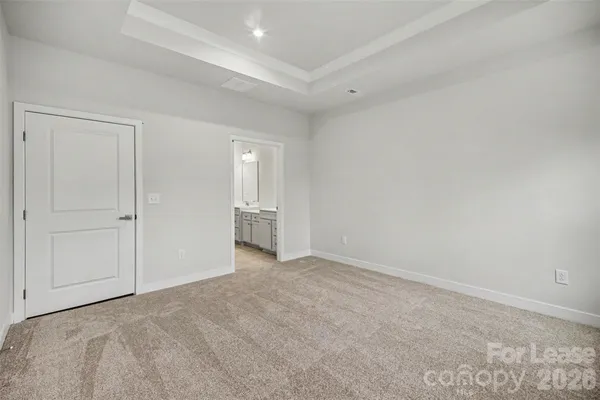 a view of an empty room and closet area