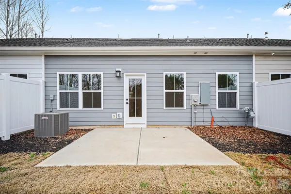 a outside view of a house with a snow on the road