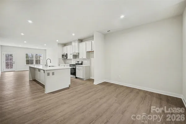 a view of kitchen with wooden floor