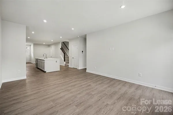 a view of kitchen with furniture and wooden floor