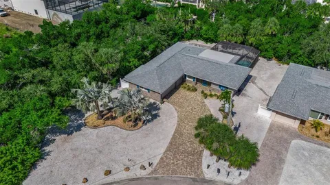an aerial view of a house with outdoor space