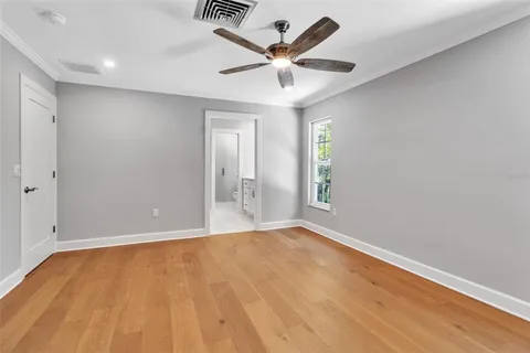 a bathroom with a double vanity sink toilet and a mirror
