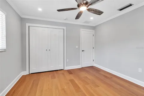 a bathroom with a granite countertop sink a toilet and a mirror