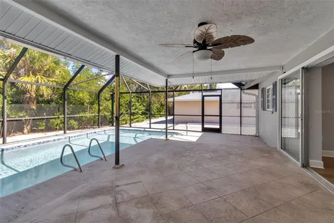 a view of an empty room with a floor to ceiling window and an outdoor view