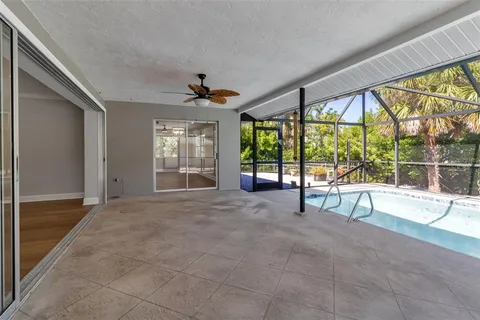 a view of a swimming pool with a patio