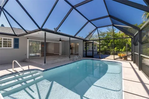 a view of a house with backyard and porch