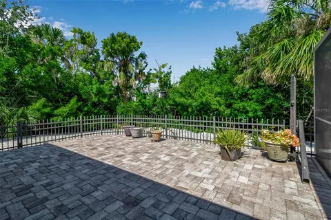 a view of a backyard with a table and chairs