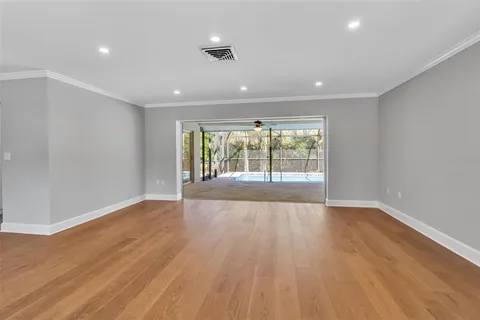 a view of wooden floor in an empty room