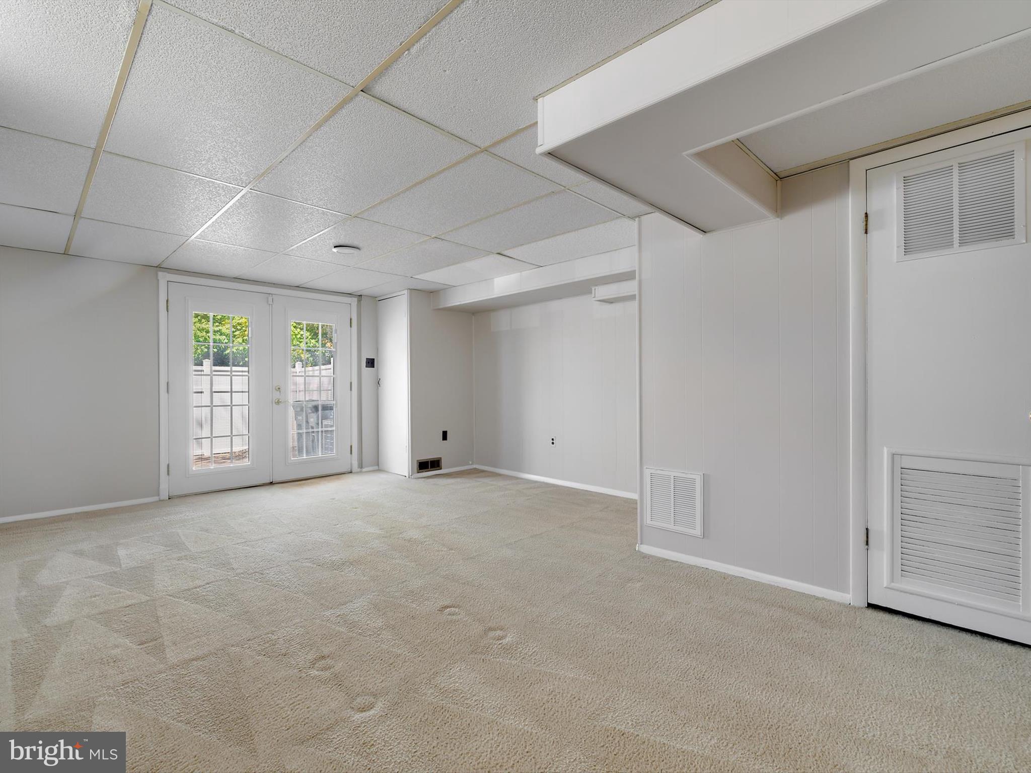 8366 Imperial Drive, Unit 2A Laurel, MD 20708 - Photo 18 of 27 a view of an empty room with windows