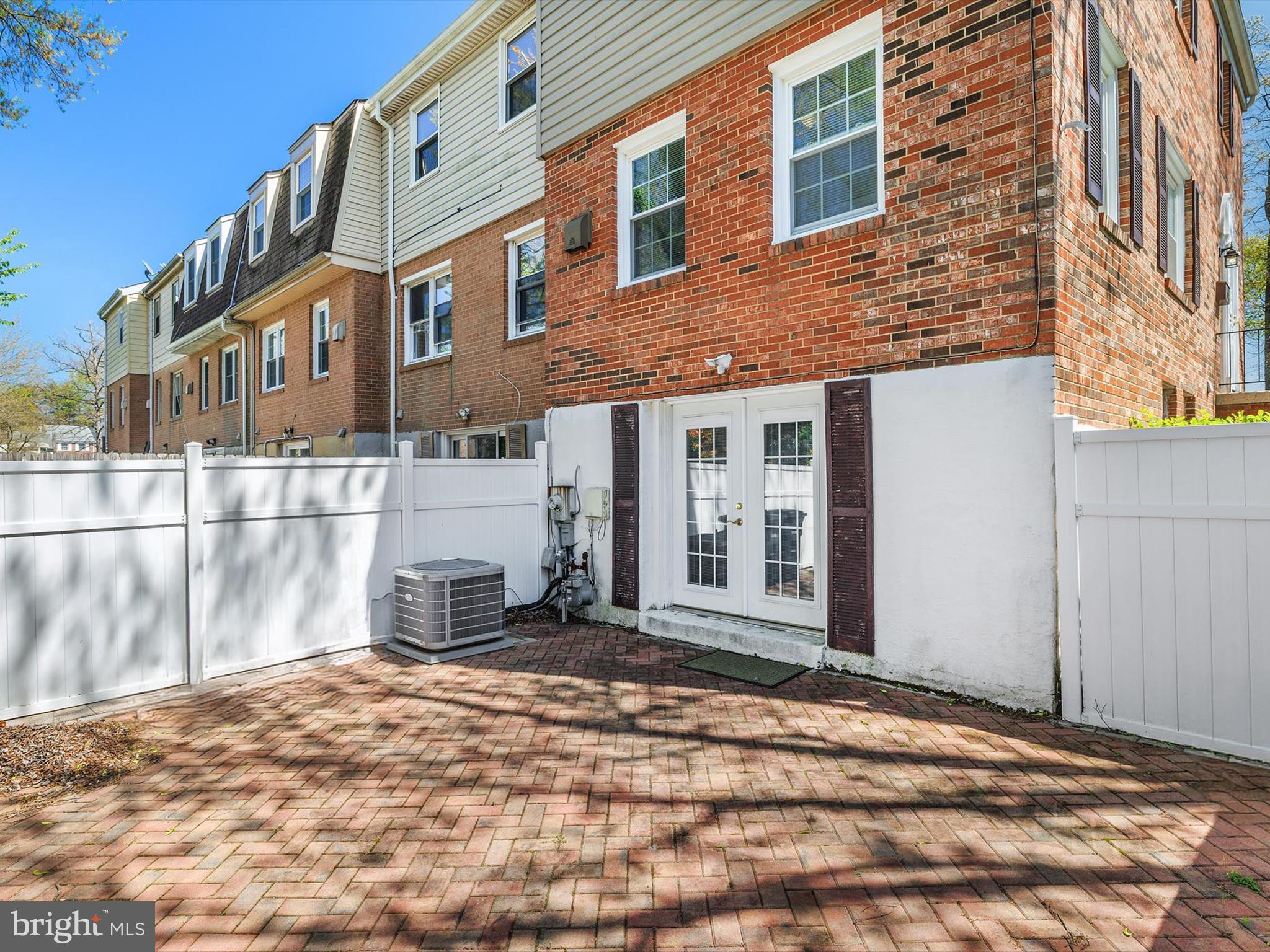 8366 Imperial Drive, Unit 2A Laurel, MD 20708 - Photo 24 of 27 a front view of a house with a yard