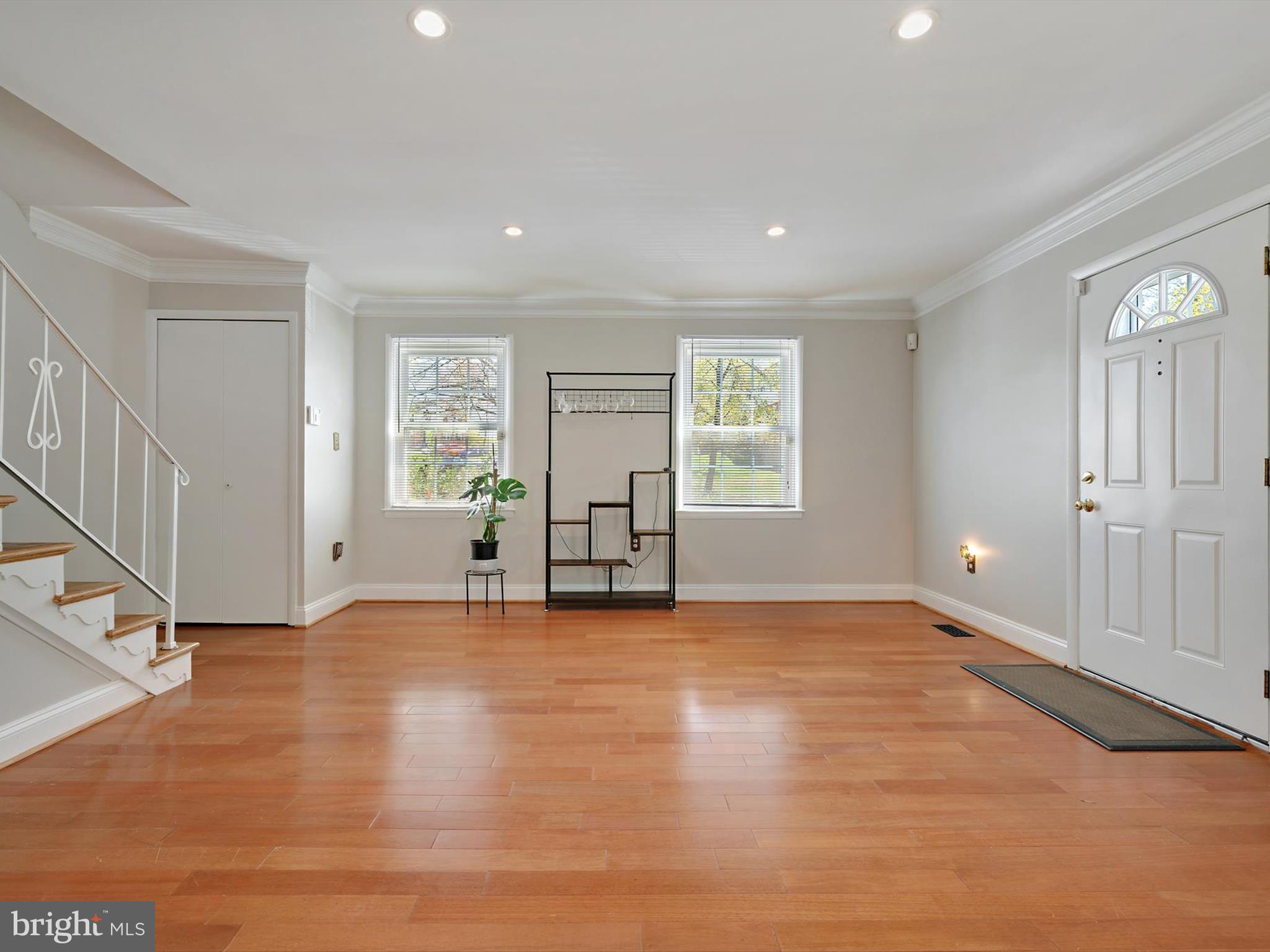8366 Imperial Drive, Unit 2A Laurel, MD 20708 - Photo 3 of 27 a view of an empty room with window and wooden floor
