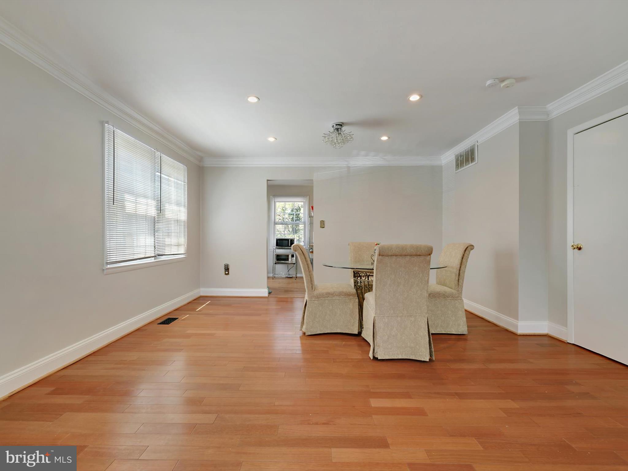 8366 Imperial Drive, Unit 2A Laurel, MD 20708 - Photo 5 of 27 a view of a work space with furniture and wooden floor