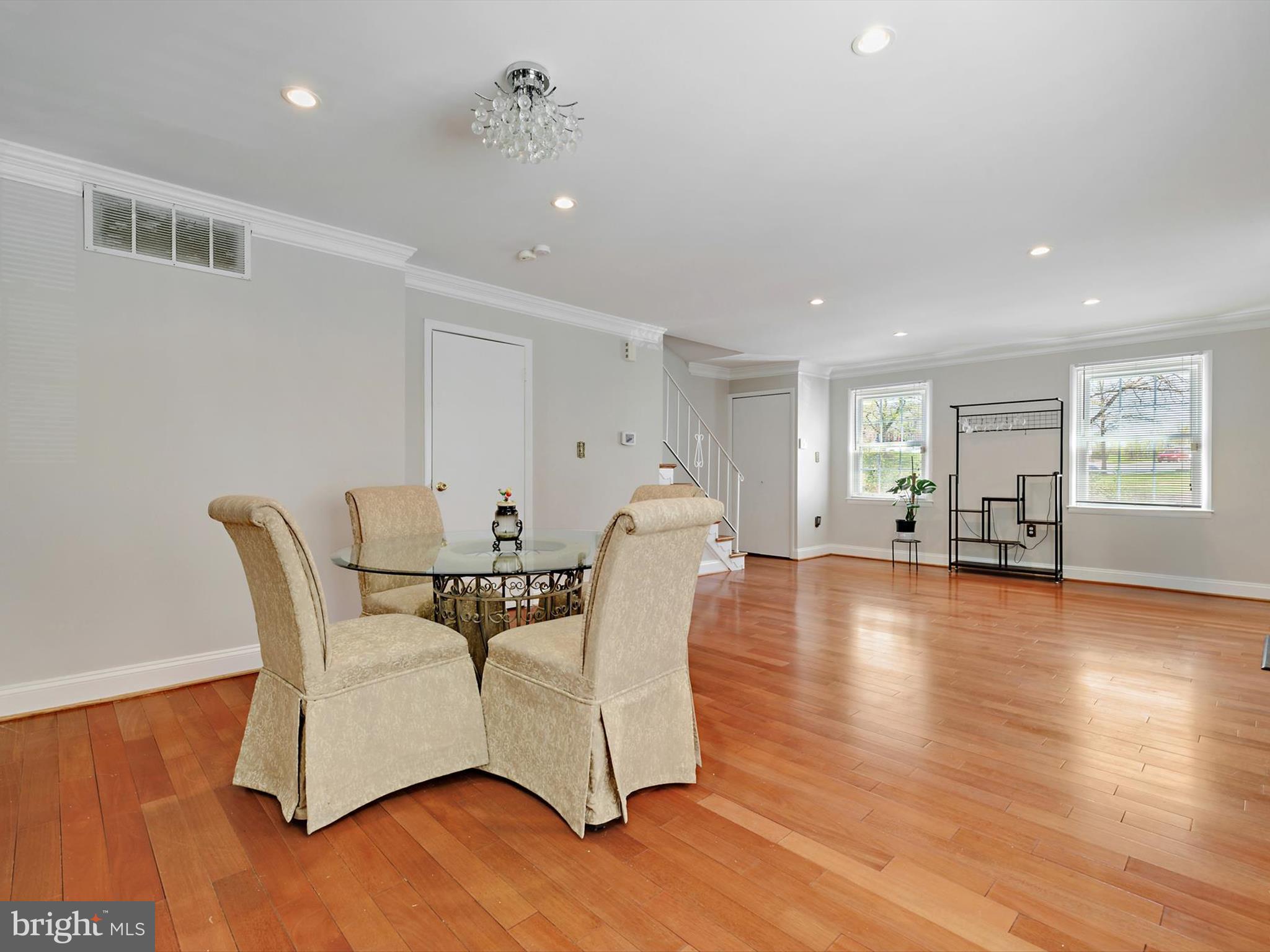 8366 Imperial Drive, Unit 2A Laurel, MD 20708 - Photo 6 of 27 a living room with furniture and wooden floor
