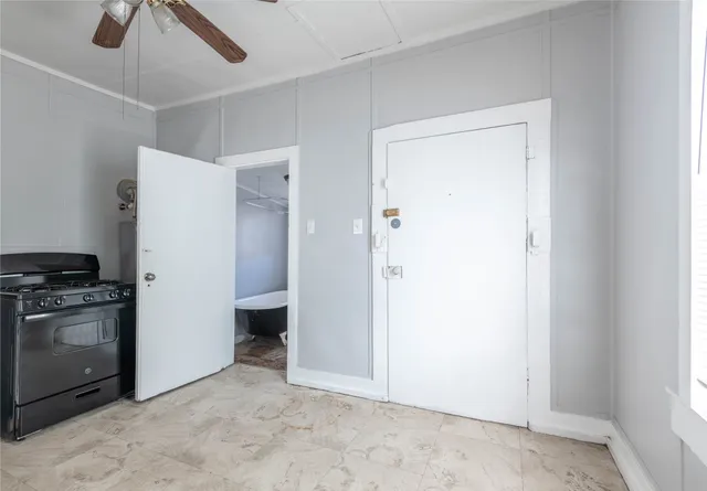 a view of a kitchen with a sink refrigerator and window