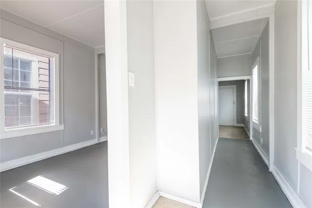 a view of a hallway with windows